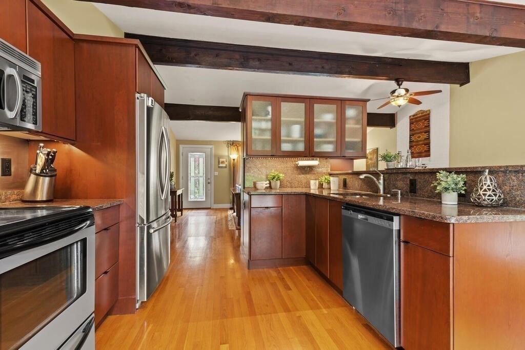 19 West Chardon Road Winchester, MA 01890 - Photo 15 of 40 a kitchen with stainless steel appliances granite countertop a stove and a sink