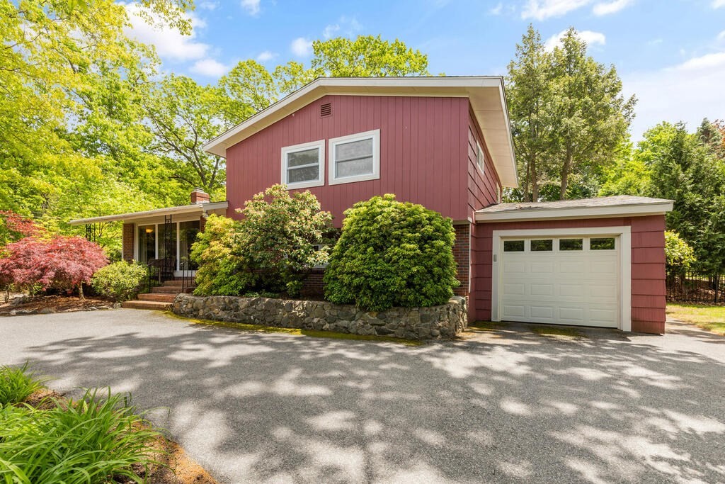 19 West Chardon Road Winchester, MA 01890 - Photo 2 of 40 a front view of a house with a yard and garage