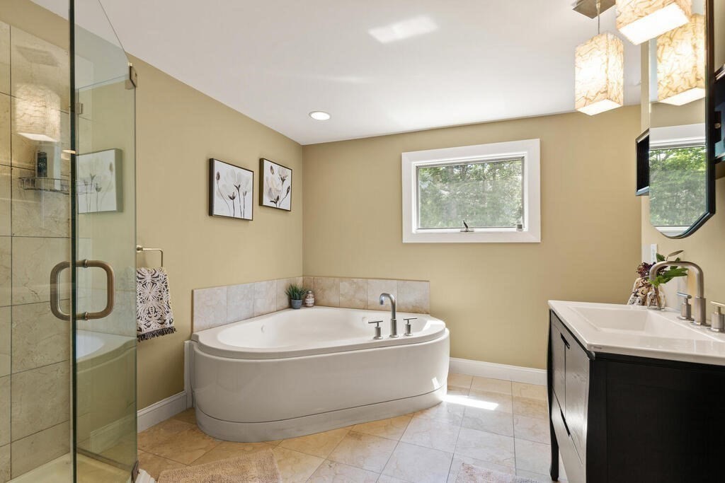 19 West Chardon Road Winchester, MA 01890 - Photo 21 of 40 a bathroom with a bathtub and shower