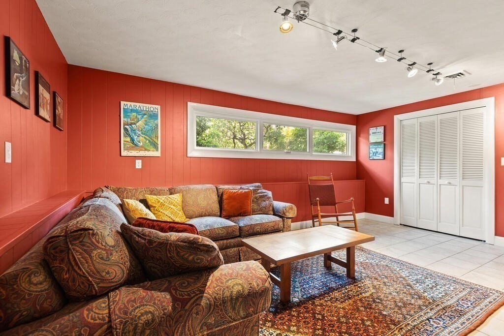 19 West Chardon Road Winchester, MA 01890 - Photo 24 of 40 a living room with furniture a rug and a window