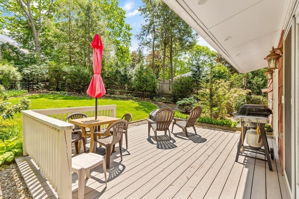 19 West Chardon Road Winchester, MA 01890 - Photo 25 of 40 a view of a patio with a table and chairs