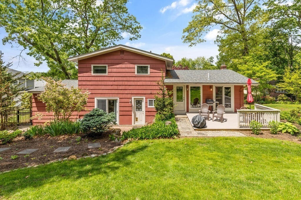 19 West Chardon Road Winchester, MA 01890 - Photo 26 of 40 a front view of house with yard and outdoor seating