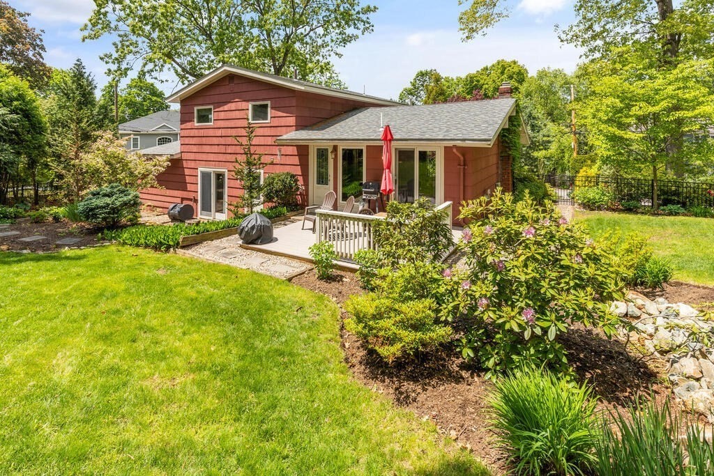 19 West Chardon Road Winchester, MA 01890 - Photo 28 of 40 a view of a house with a yard and sitting area