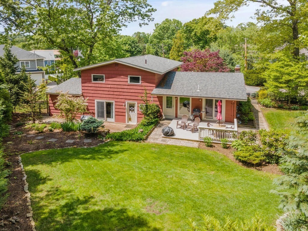 19 West Chardon Road Winchester, MA 01890 - Photo 33 of 40 a front view of a house with swimming pool having outdoor seating