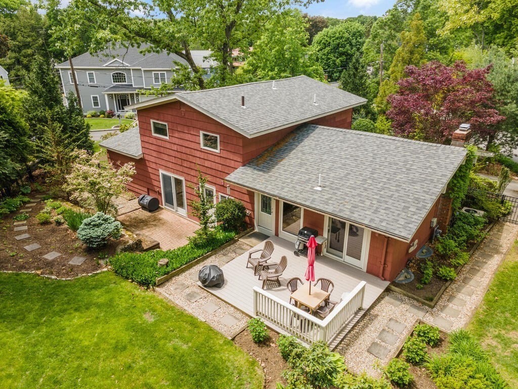 19 West Chardon Road Winchester, MA 01890 - Photo 35 of 40 an aerial view of a house with table and chairs under an umbrella