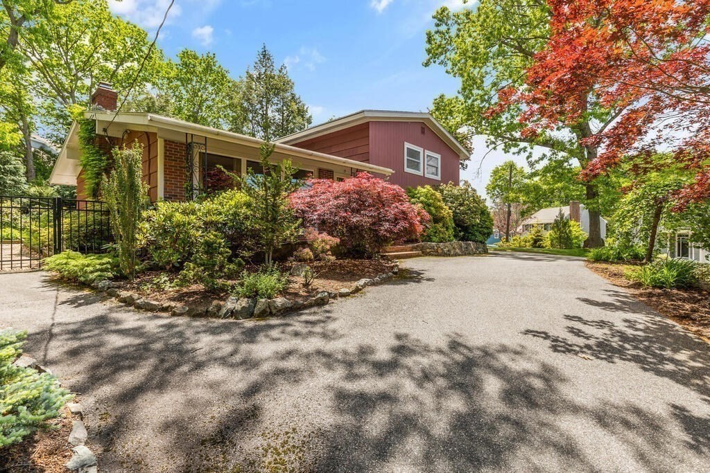 19 West Chardon Road Winchester, MA 01890 - Photo 37 of 40 a view of a house with a yard and potted plants