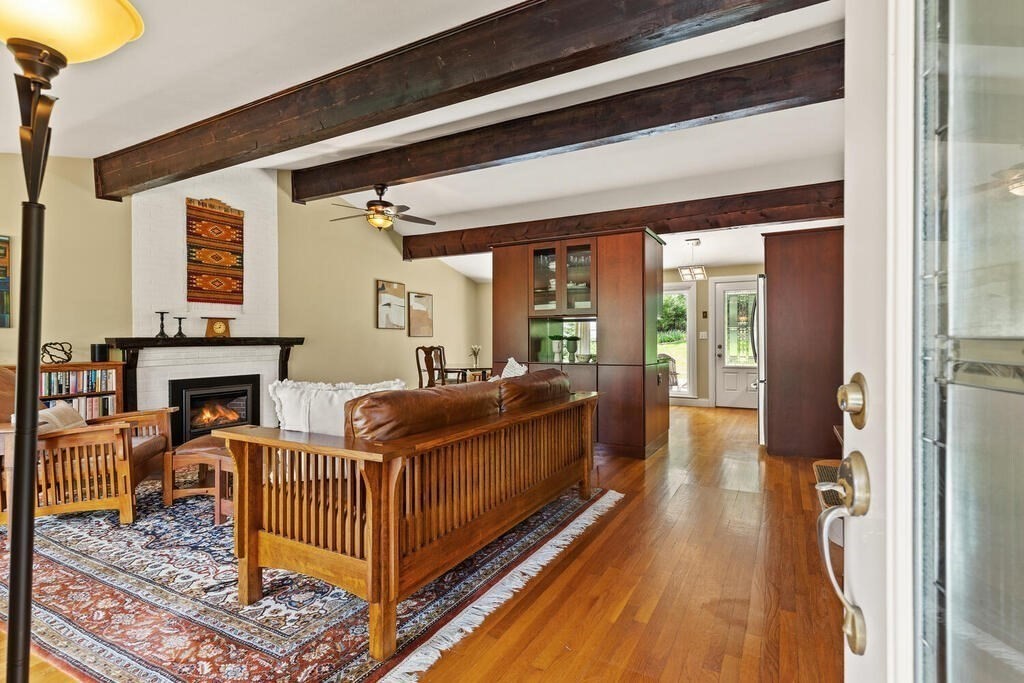 19 West Chardon Road Winchester, MA 01890 - Photo 4 of 40 a view of a porch with wooden floor and iron stairs
