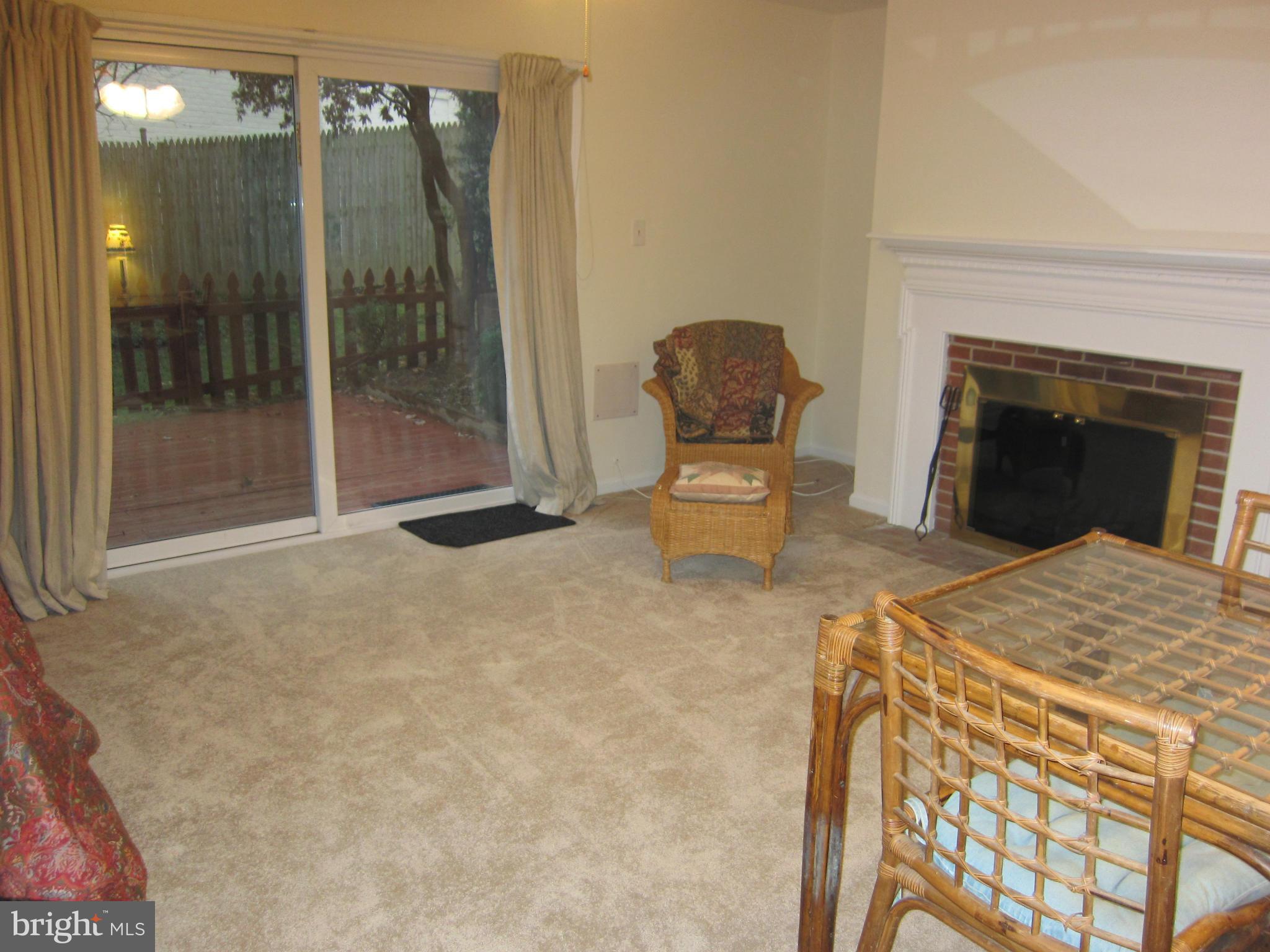 2208 Bucknell Terrace, Unit 24 Silver Spring, MD 20902 - Photo 21 of 28 Wood burning fireplace on lower level