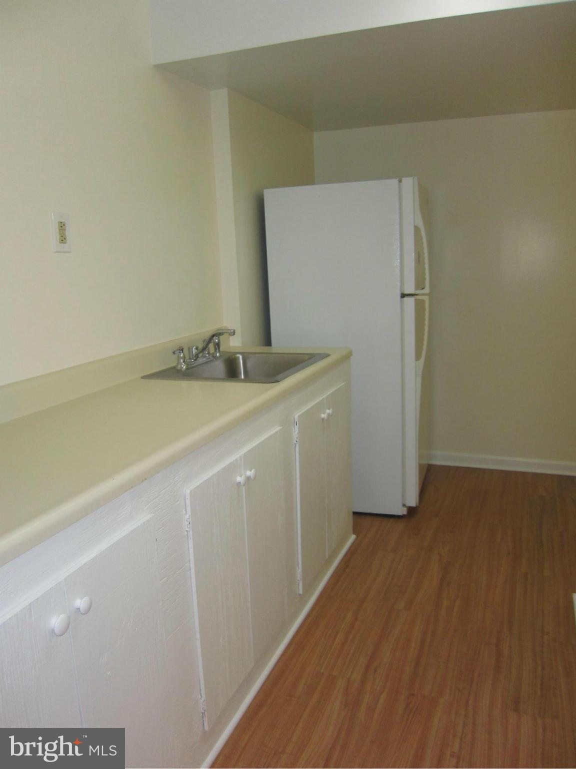 2208 Bucknell Terrace, Unit 24 Silver Spring, MD 20902 - Photo 23 of 28 LL efficiency kitchen, new laminate floor