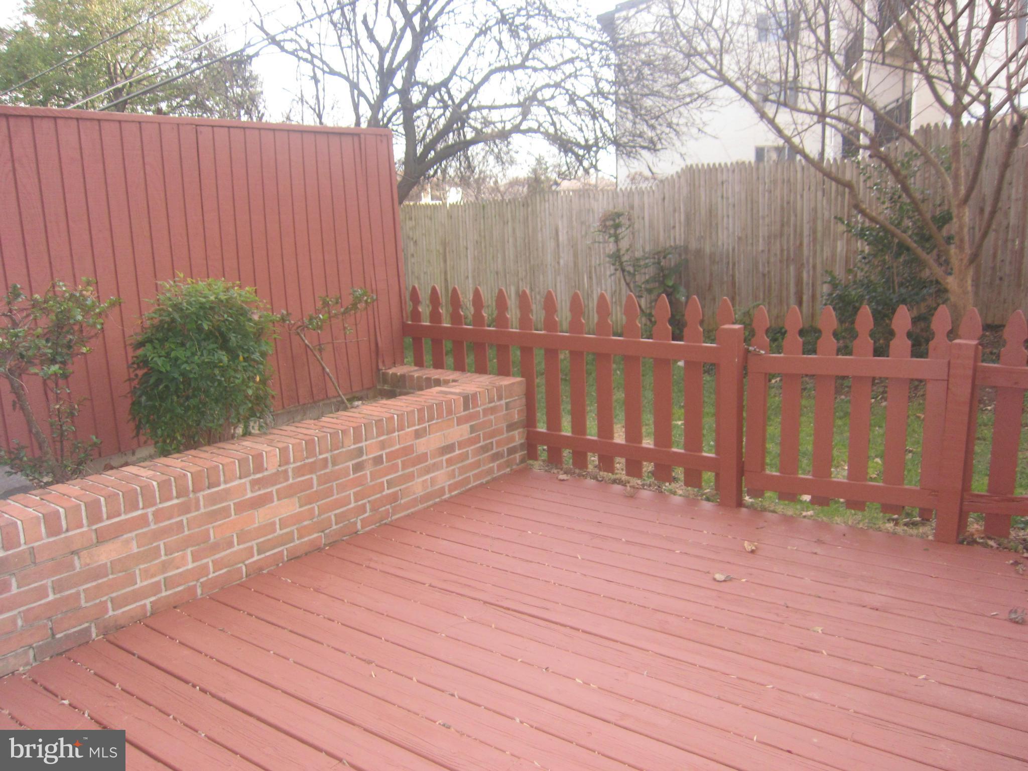 2208 Bucknell Terrace, Unit 24 Silver Spring, MD 20902 - Photo 25 of 28 Wood deck on lower level, raised garden