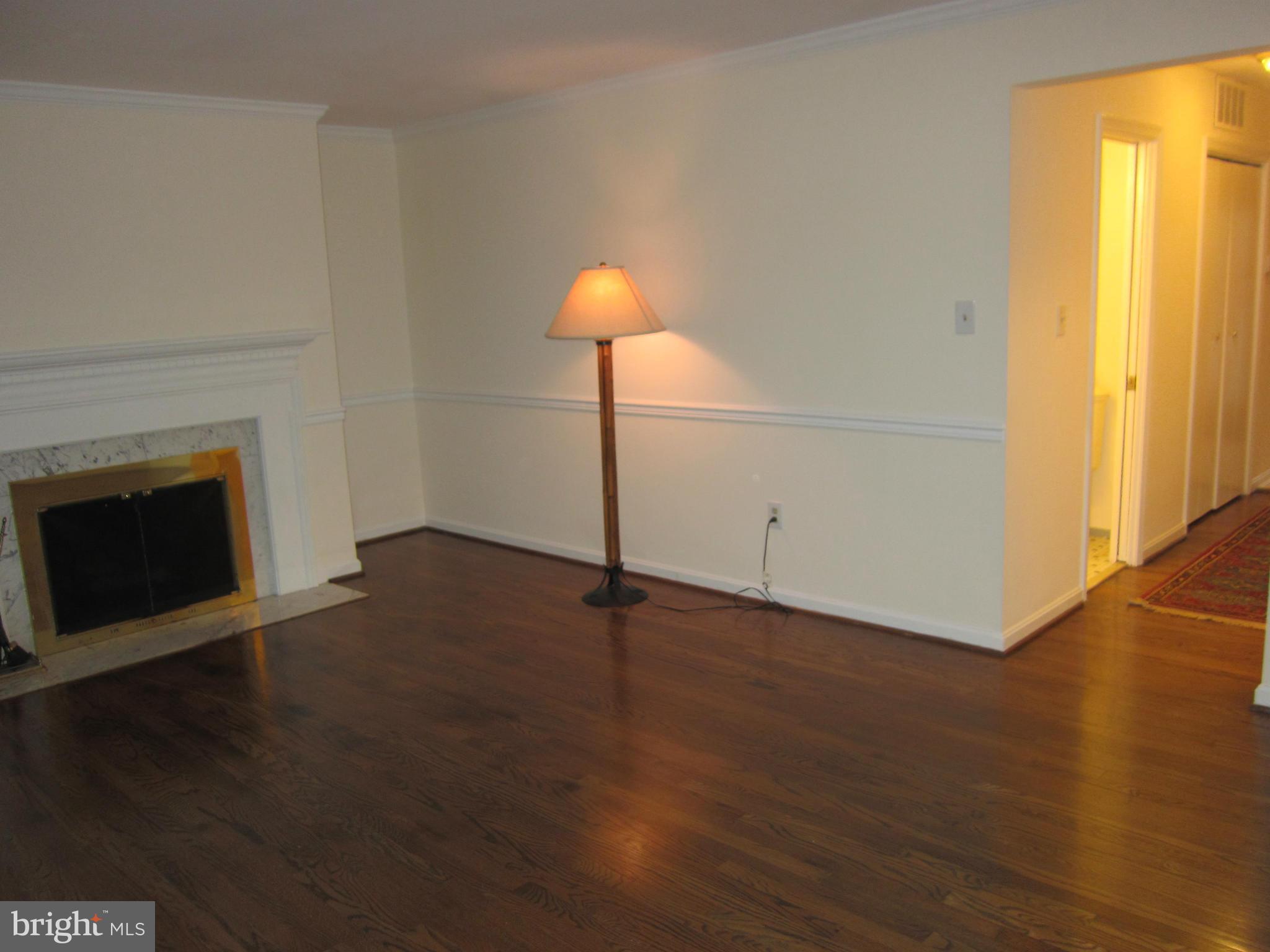 2208 Bucknell Terrace, Unit 24 Silver Spring, MD 20902 - Photo 7 of 28 Hardwoods through hall and living room
