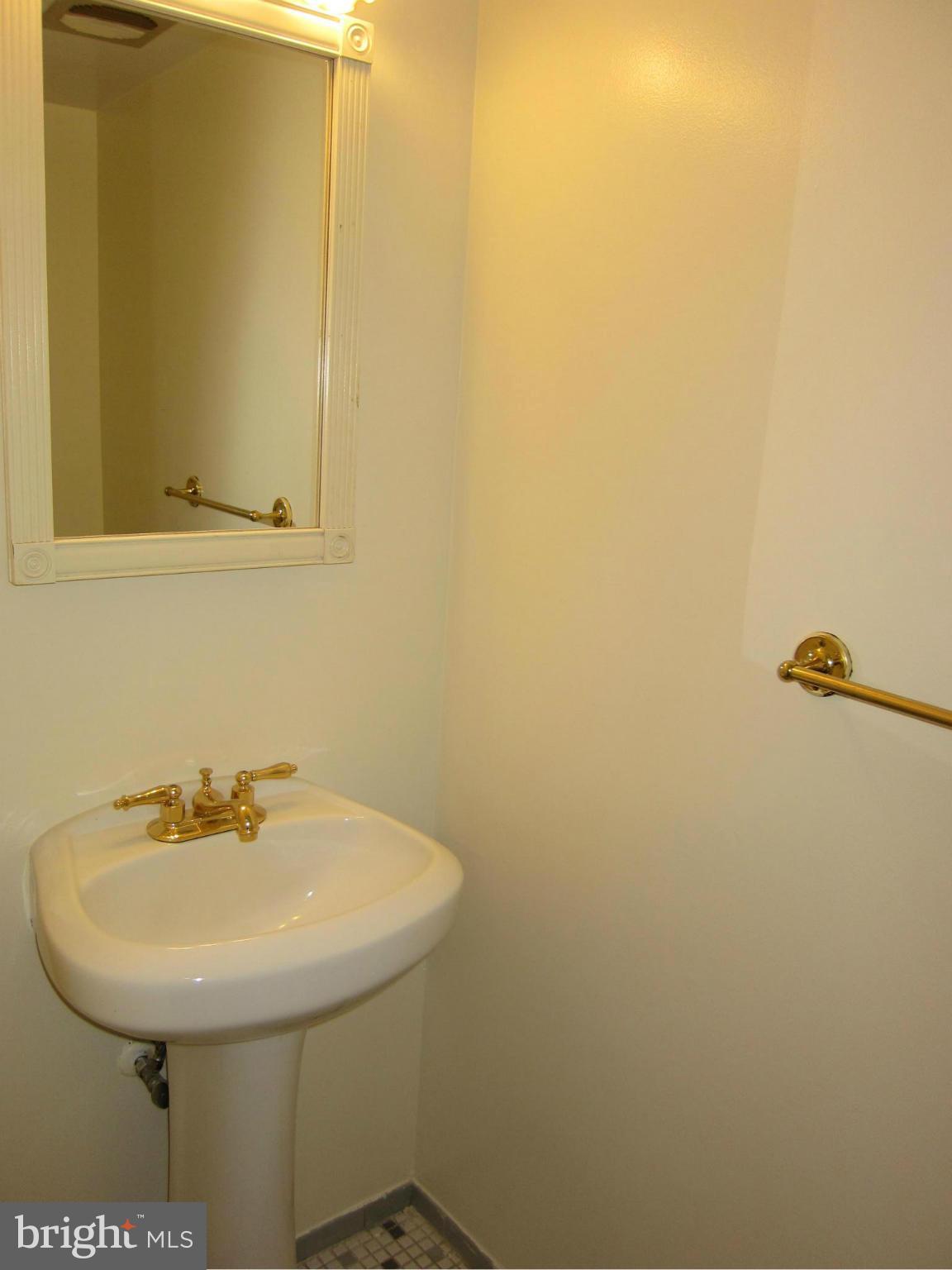 2208 Bucknell Terrace, Unit 24 Silver Spring, MD 20902 - Photo 8 of 28 Half bath on main level, pocket doors, hw floor