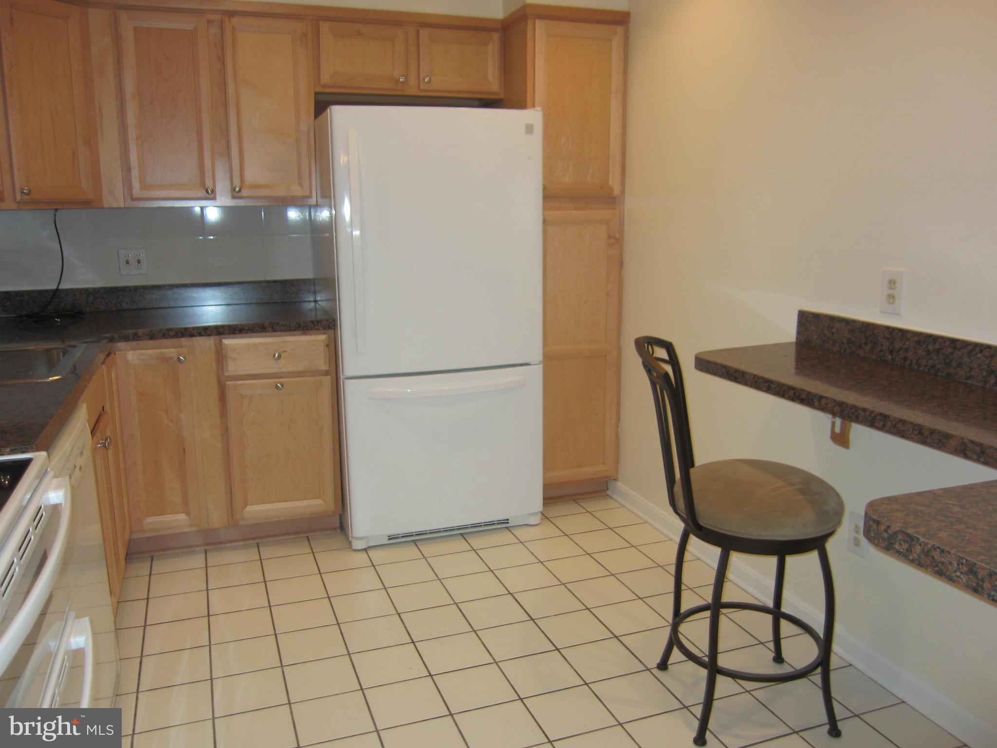 2208 Bucknell Terrace, Unit 24 Silver Spring, MD 20902 - Photo 10 of 28 Kitchen with tile floor, coffee counter