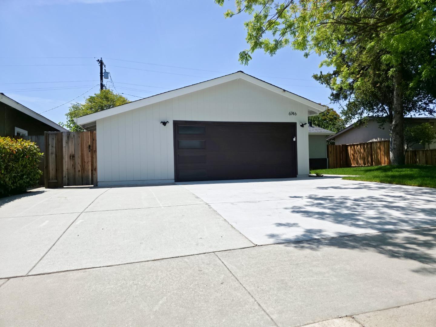 6746 Bollinger Road San Jose, CA 95129 - Photo 2 of 30 a front view of a house with a yard