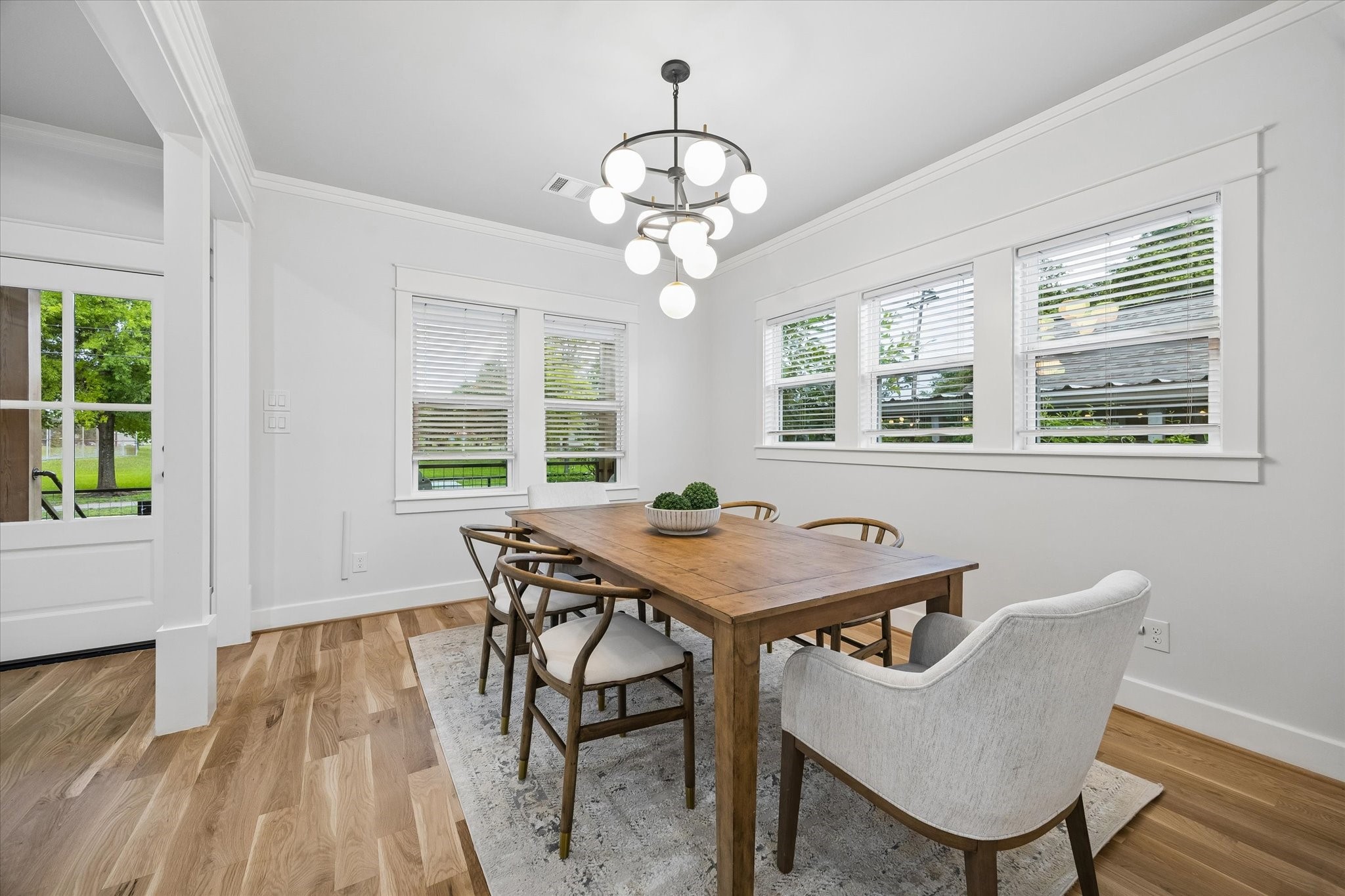 910 Northwood Street Houston, TX 77009 - Photo 6 of 28 a view of a dining room with furniture wooden floor and chandelier
