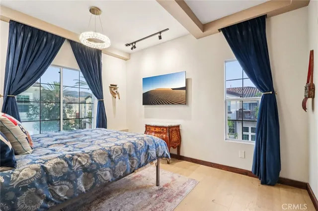 view of a lush green field with a tree in the background