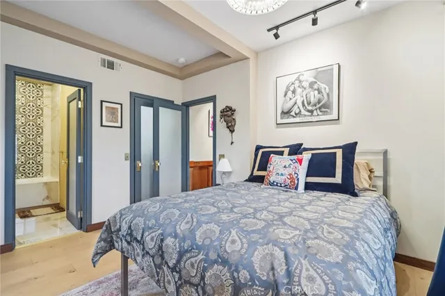 a view of a yard with plants and trees