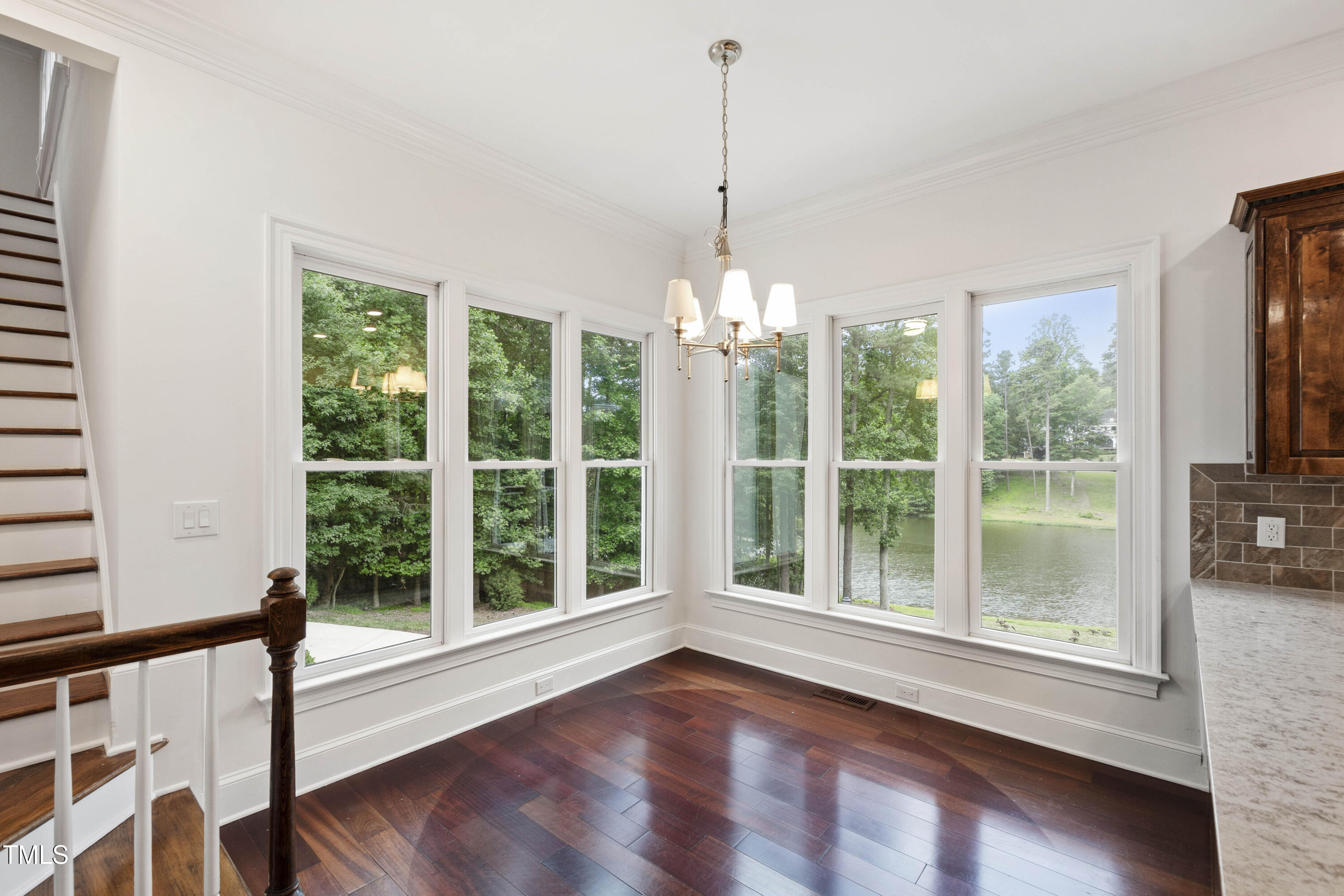 636 Pendleton Lake Road Raleigh, NC 27614 - Photo 19 of 88 a view of an empty room with wooden floor and a window