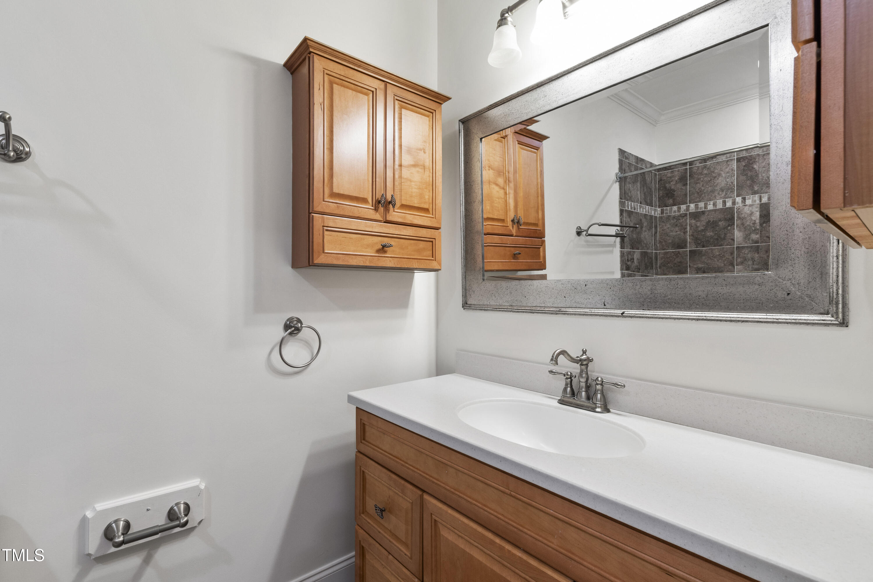 636 Pendleton Lake Road Raleigh, NC 27614 - Photo 45 of 88 a bathroom with a sink and a mirror