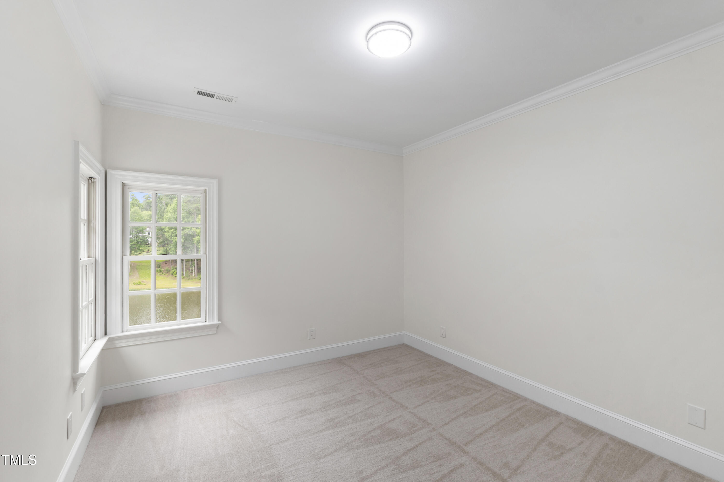 636 Pendleton Lake Road Raleigh, NC 27614 - Photo 52 of 88 an empty room with a window