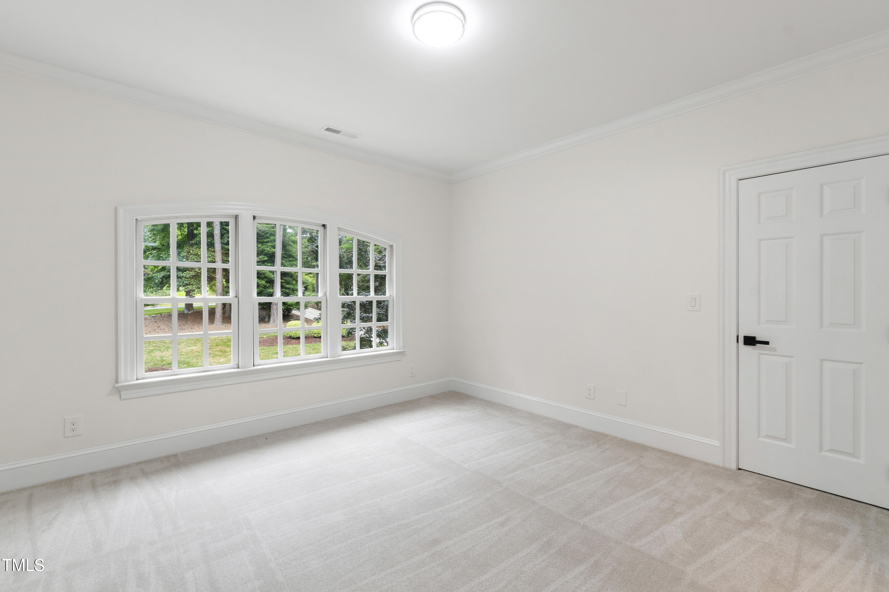 636 Pendleton Lake Road Raleigh, NC 27614 - Photo 61 of 88 an empty room with a window