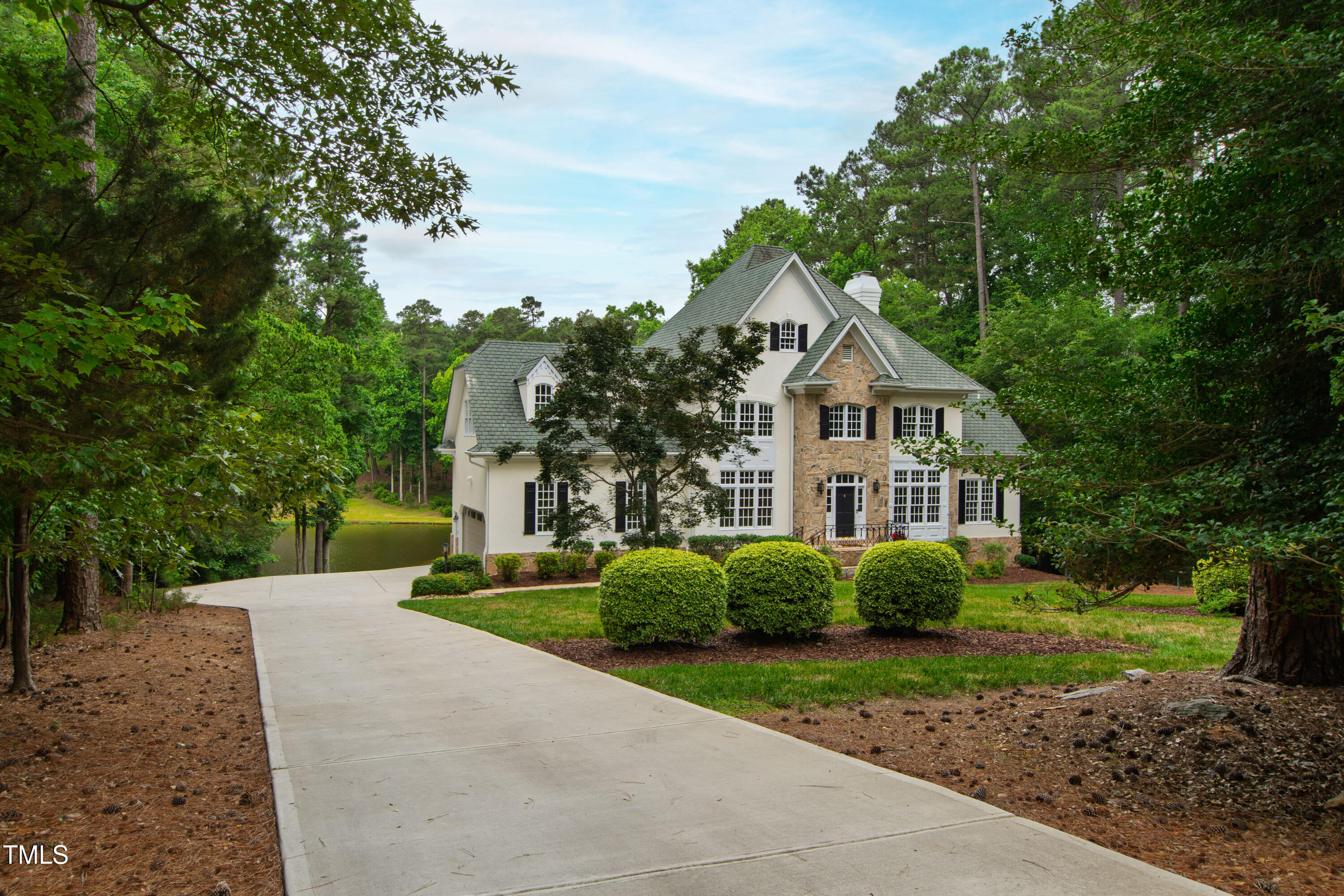 636 Pendleton Lake Road Raleigh, NC 27614 - Photo 80 of 88 a front view of a house with a garden