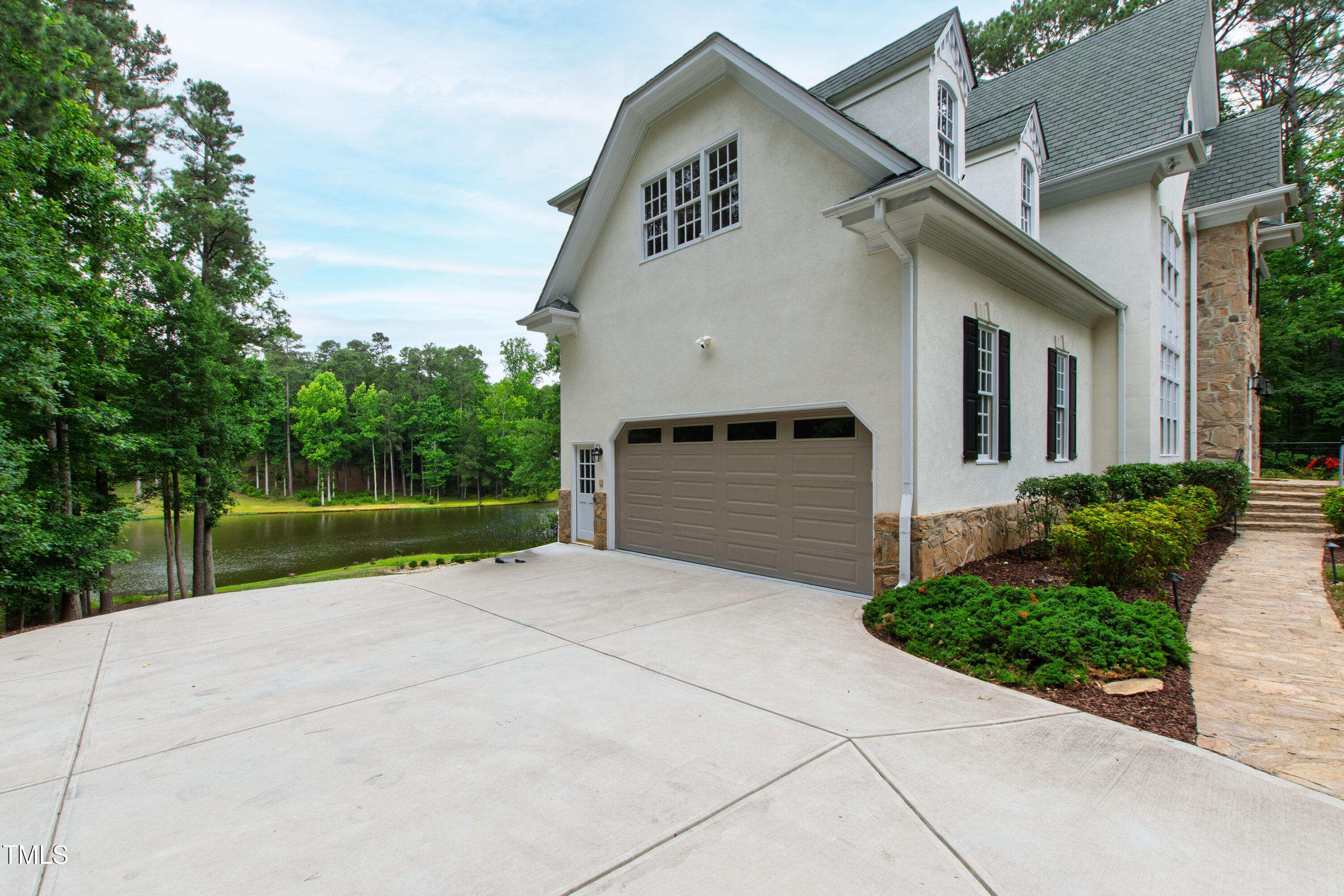 636 Pendleton Lake Road Raleigh, NC 27614 - Photo 82 of 88 a view of a white house with a small yard and large tree