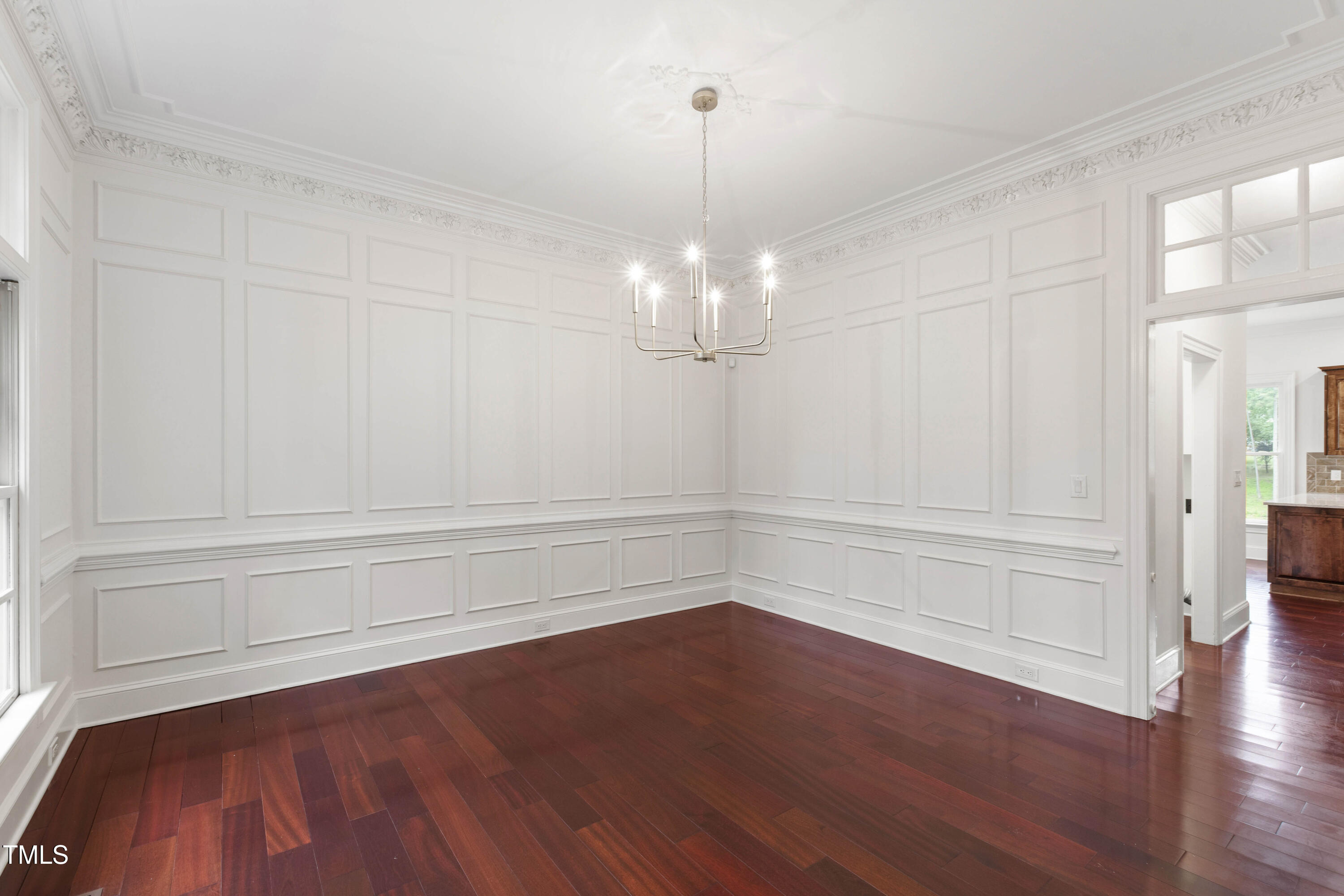 636 Pendleton Lake Road Raleigh, NC 27614 - Photo 5 of 88 a view of a room with wooden floor and white walls