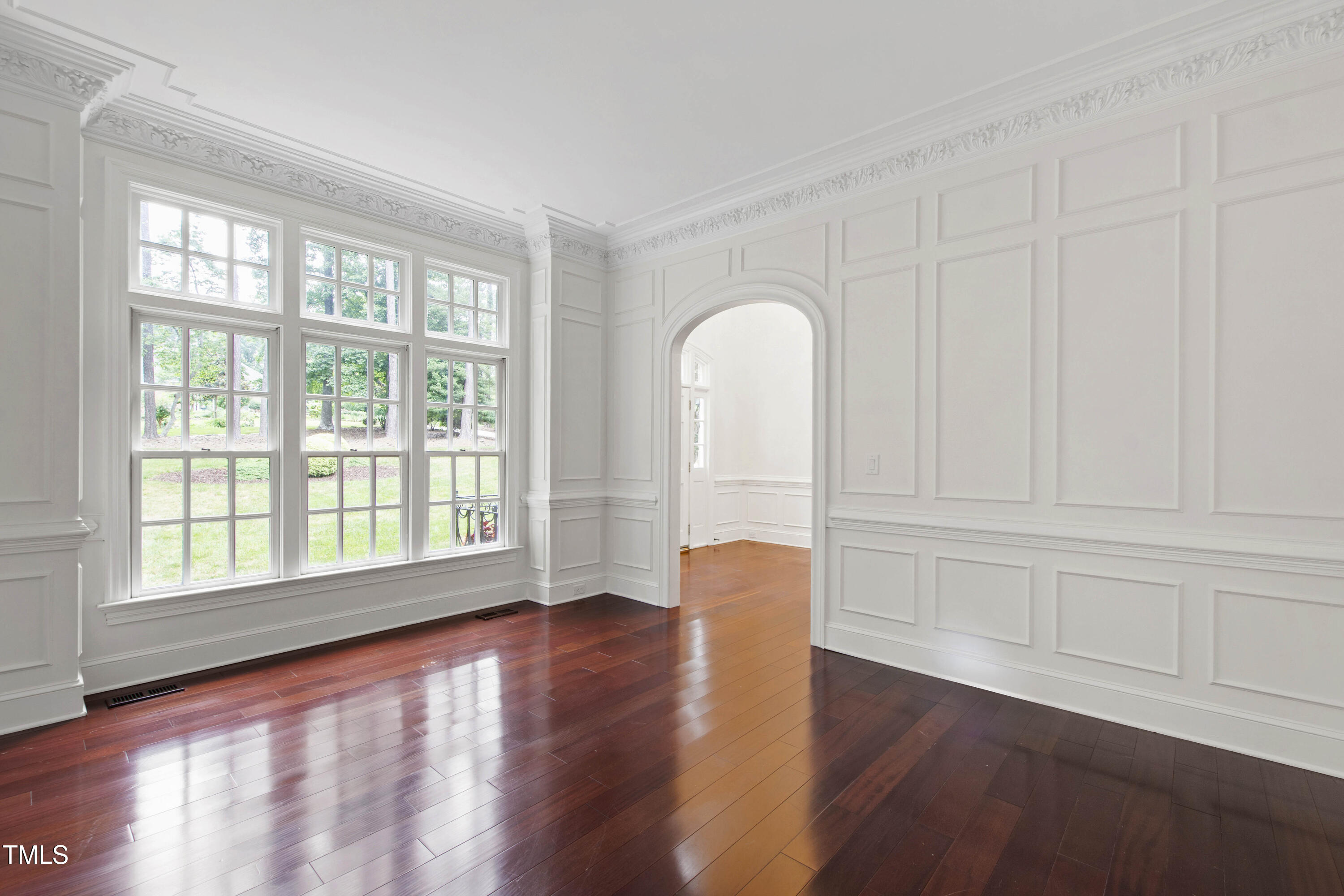 636 Pendleton Lake Road Raleigh, NC 27614 - Photo 6 of 88 a view of an empty room with a window and wooden floor