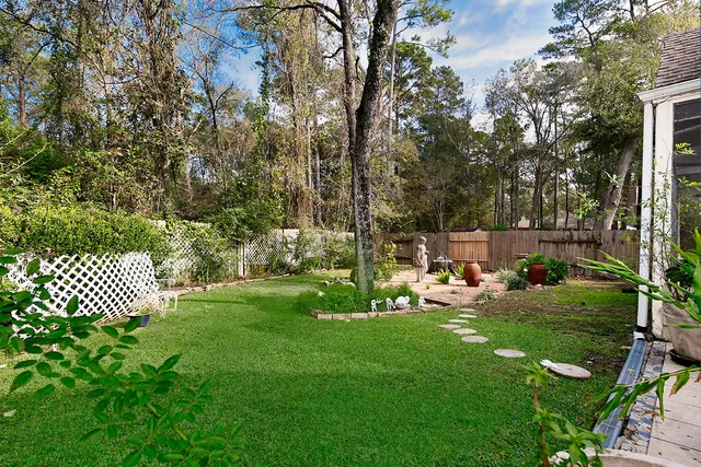 a front view of a house with garden and porch
