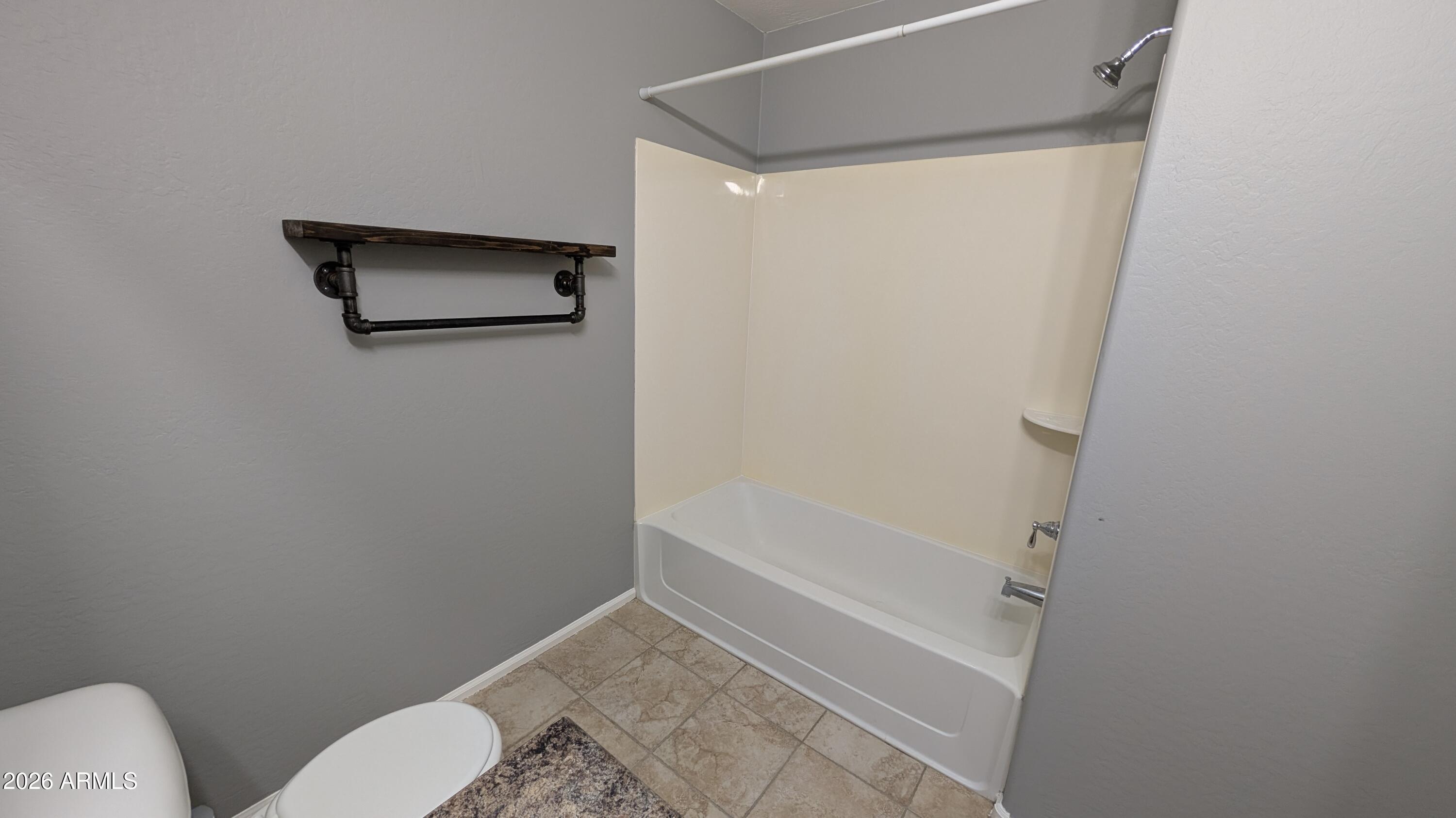1377 East Pryor Road San Tan Valley, AZ 85140 - Photo 20 of 31 a bathroom with a shower and toilet