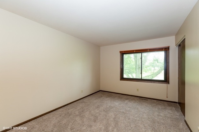 3017 Springbrook Road Crystal Lake, IL 60012 - Photo 13 of 20 an empty room with windows