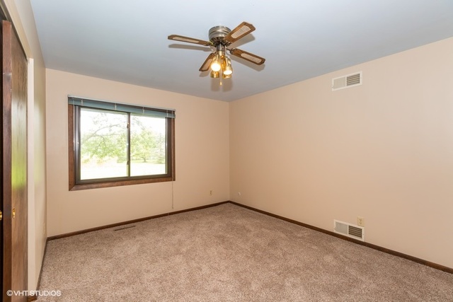 3017 Springbrook Road Crystal Lake, IL 60012 - Photo 14 of 20 an empty room with a window