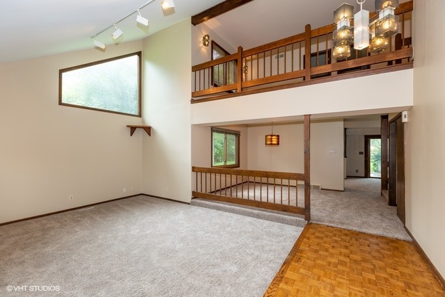 3017 Springbrook Road Crystal Lake, IL 60012 - Photo 3 of 20 a view of a living room with a balcony