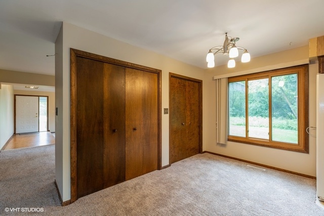3017 Springbrook Road Crystal Lake, IL 60012 - Photo 6 of 20 a view of an empty room with a window
