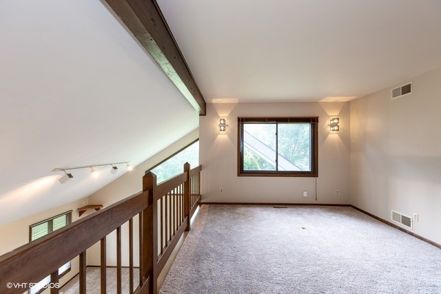 3017 Springbrook Road Crystal Lake, IL 60012 - Photo 10 of 20 a view of room with window and stairs