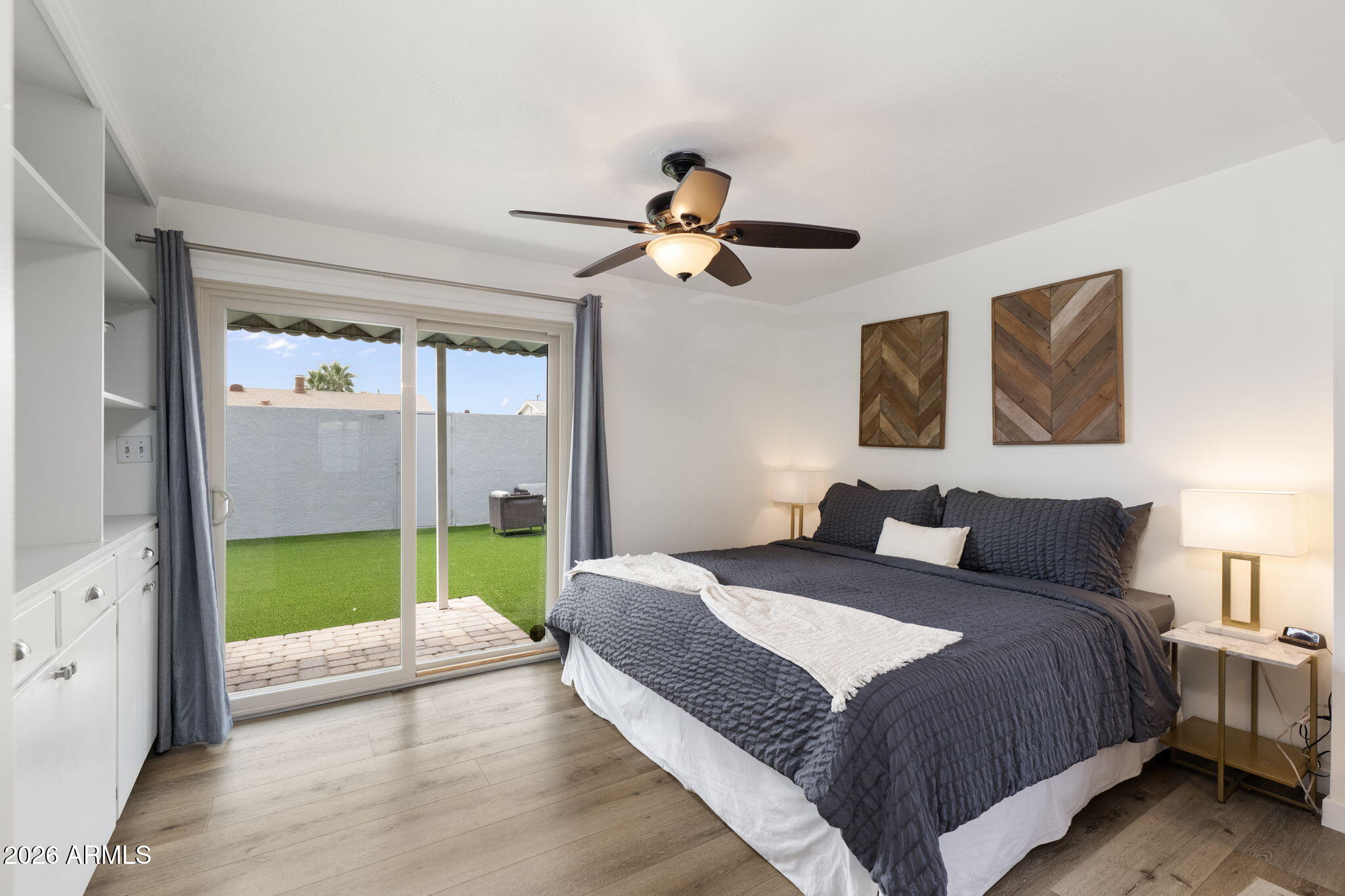 133 East Pierce Street Tempe, AZ 85288 - Photo 26 of 37 a bedroom with a bed and a chandelier