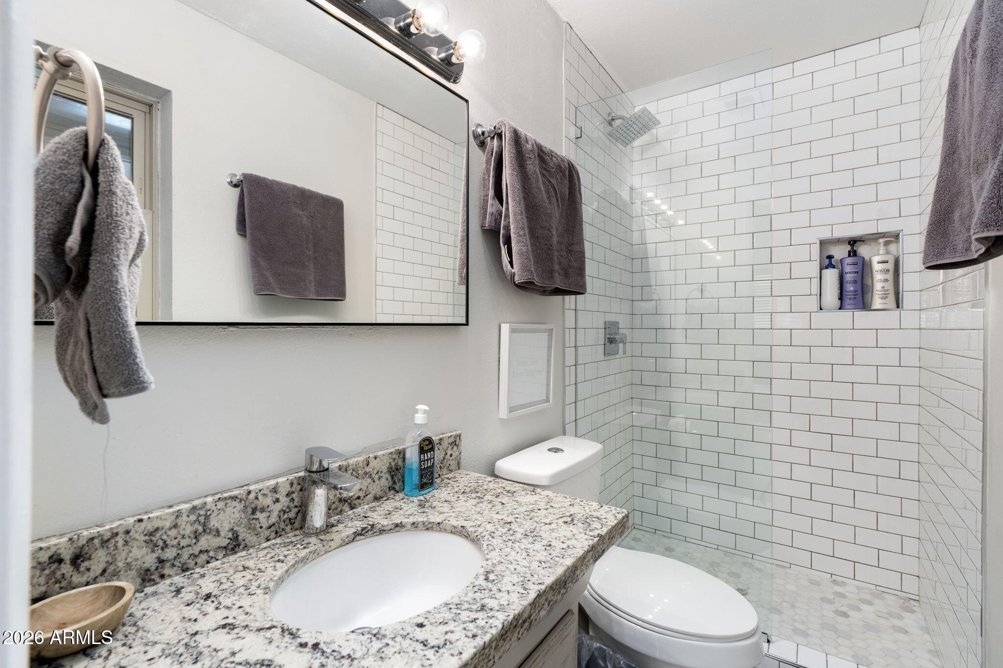 133 East Pierce Street Tempe, AZ 85288 - Photo 27 of 37 a bathroom with a granite countertop sink a toilet and mirror