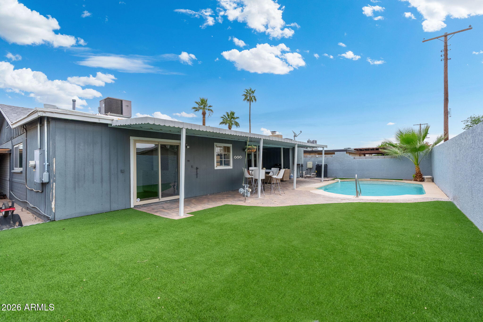 133 East Pierce Street Tempe, AZ 85288 - Photo 34 of 37 a view of a house with a backyard porch and sitting area