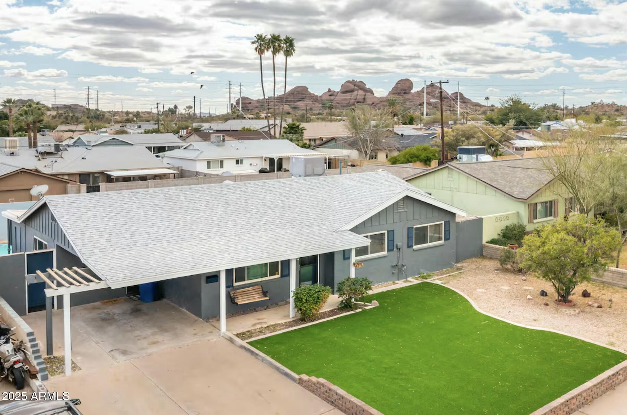 133 East Pierce Street Tempe, AZ 85288 - Photo 4 of 37 a view of a house with a backyard porch and sitting area