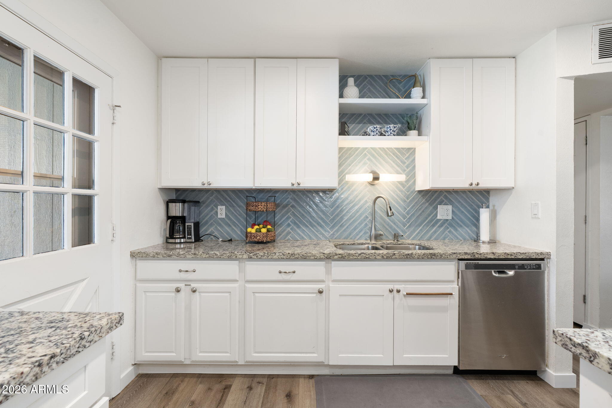 133 East Pierce Street Tempe, AZ 85288 - Photo 9 of 37 a kitchen with white cabinets and sink