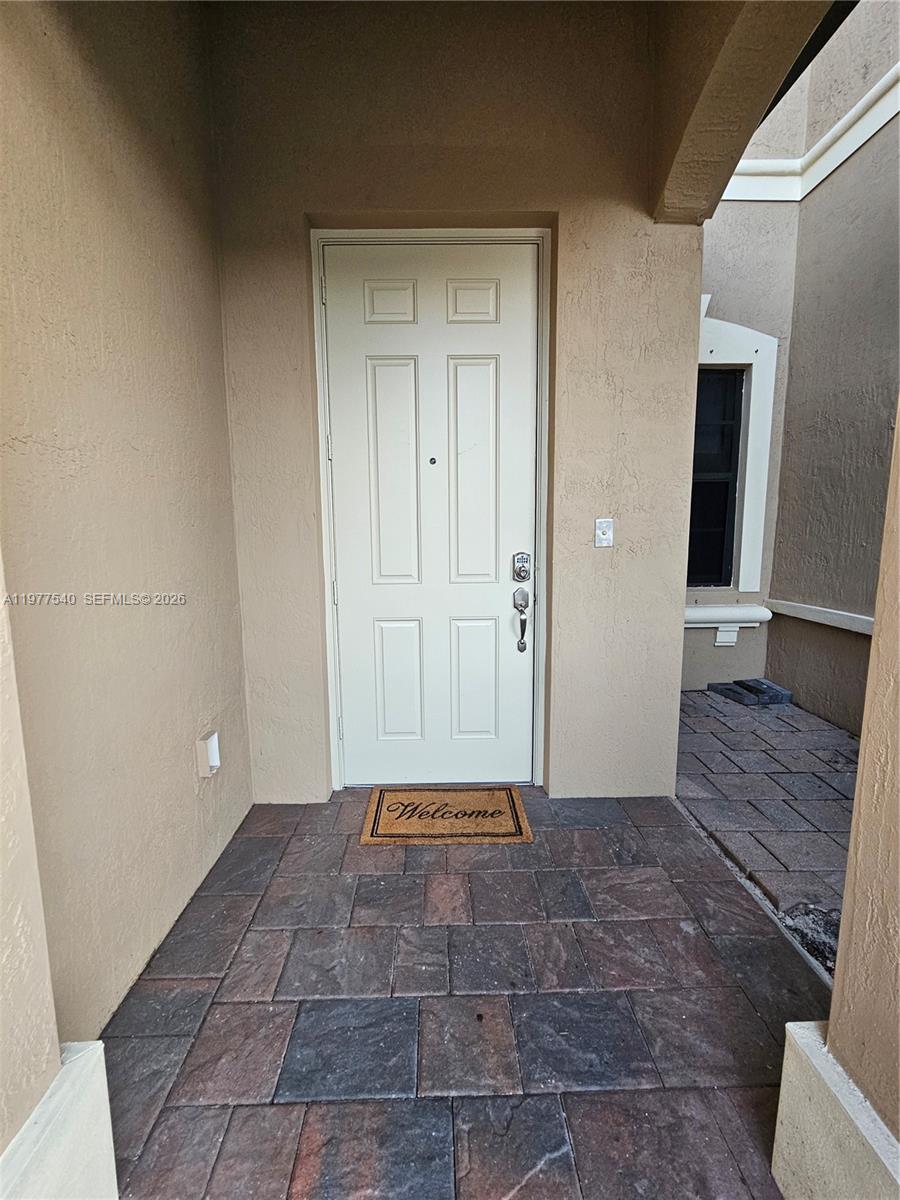 3370 West 90th Street, Unit A Hialeah, FL 33018 - Photo 2 of 40 a view of an empty room with wooden floor