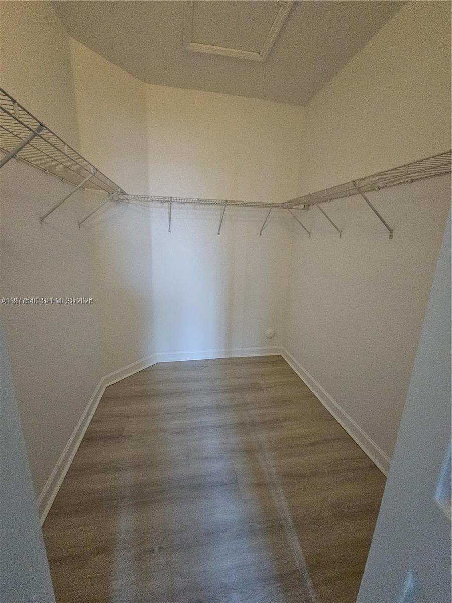 3370 West 90th Street, Unit A Hialeah, FL 33018 - Photo 22 of 40 a view of a room with racks on the wall
