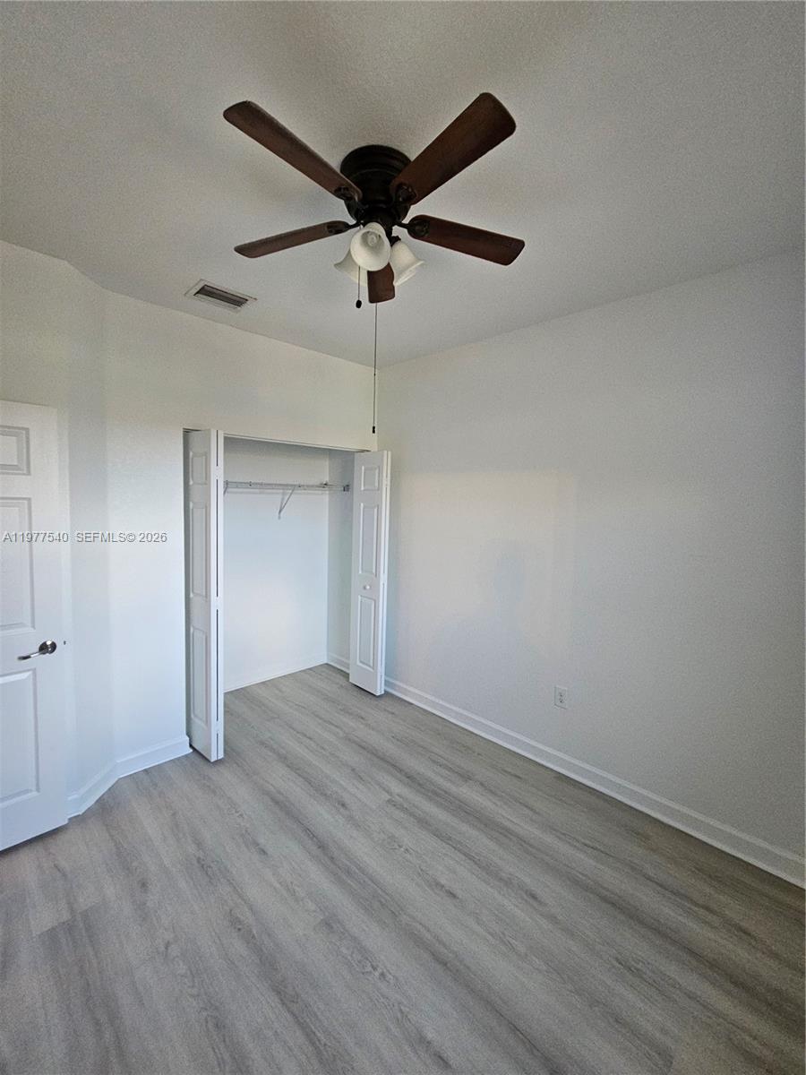 3370 West 90th Street, Unit A Hialeah, FL 33018 - Photo 27 of 40 wooden floor in an empty room