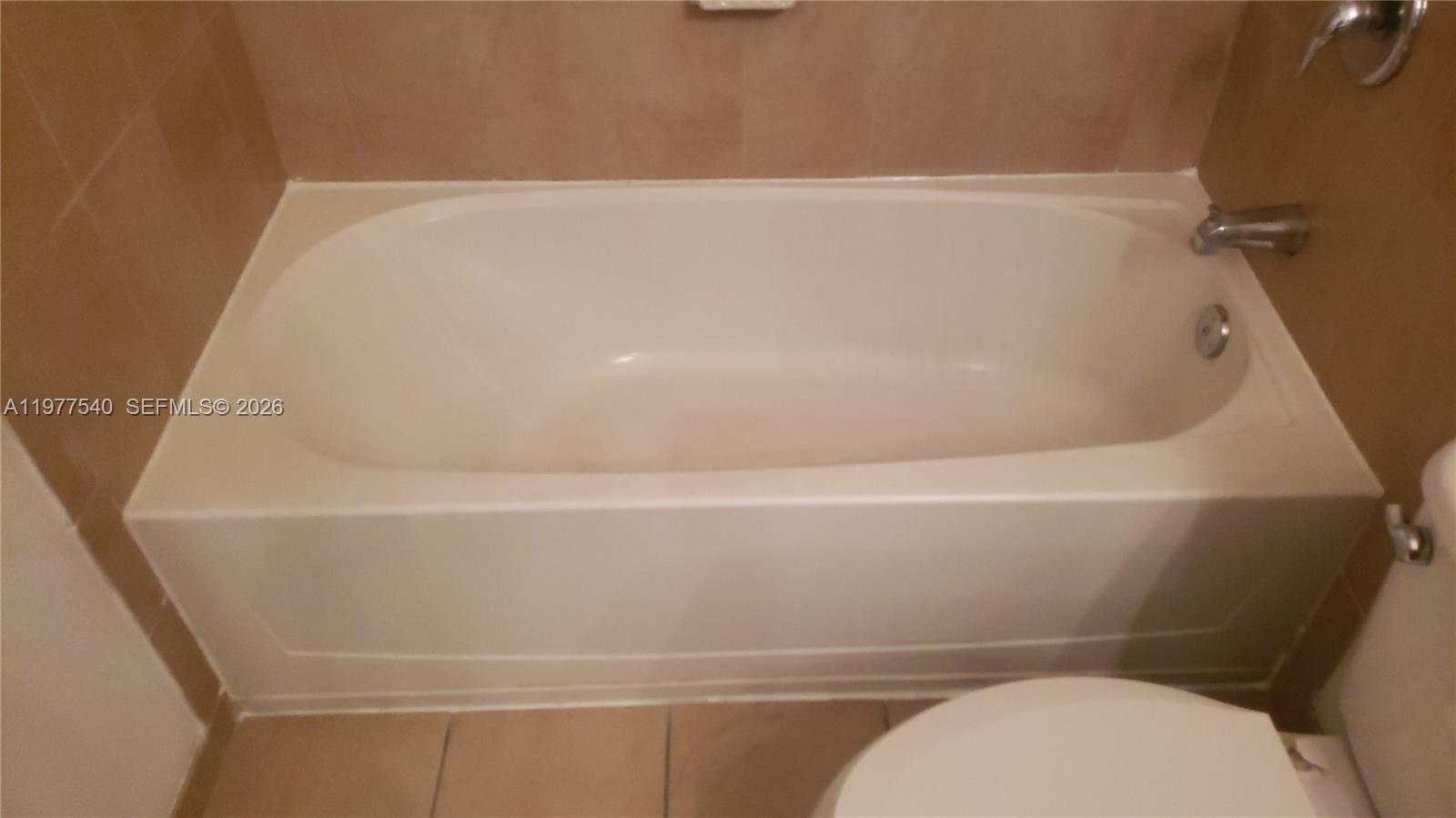 3370 West 90th Street, Unit A Hialeah, FL 33018 - Photo 30 of 40 a bathroom with a white bath tub