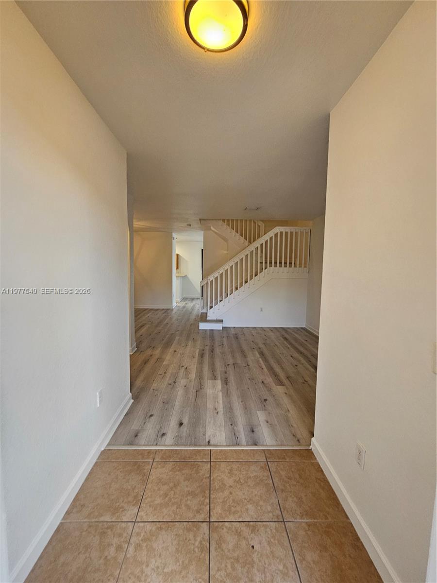3370 West 90th Street, Unit A Hialeah, FL 33018 - Photo 3 of 40 a view of entryway with wooden floor