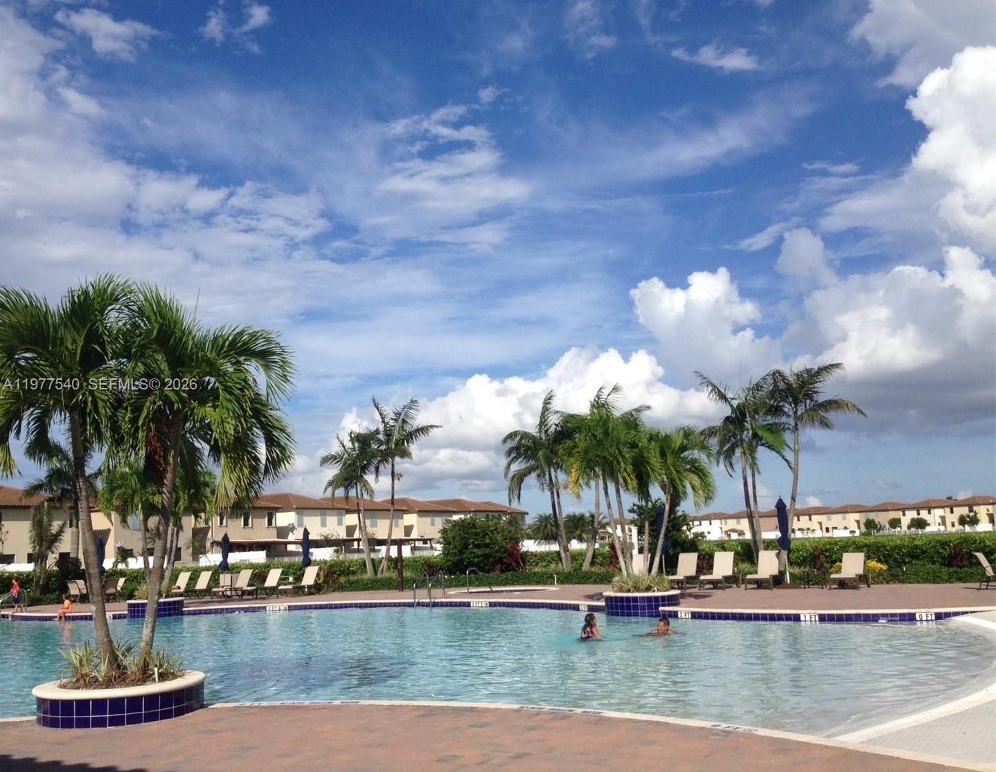 3370 West 90th Street, Unit A Hialeah, FL 33018 - Photo 38 of 40 a view of a lake with a house