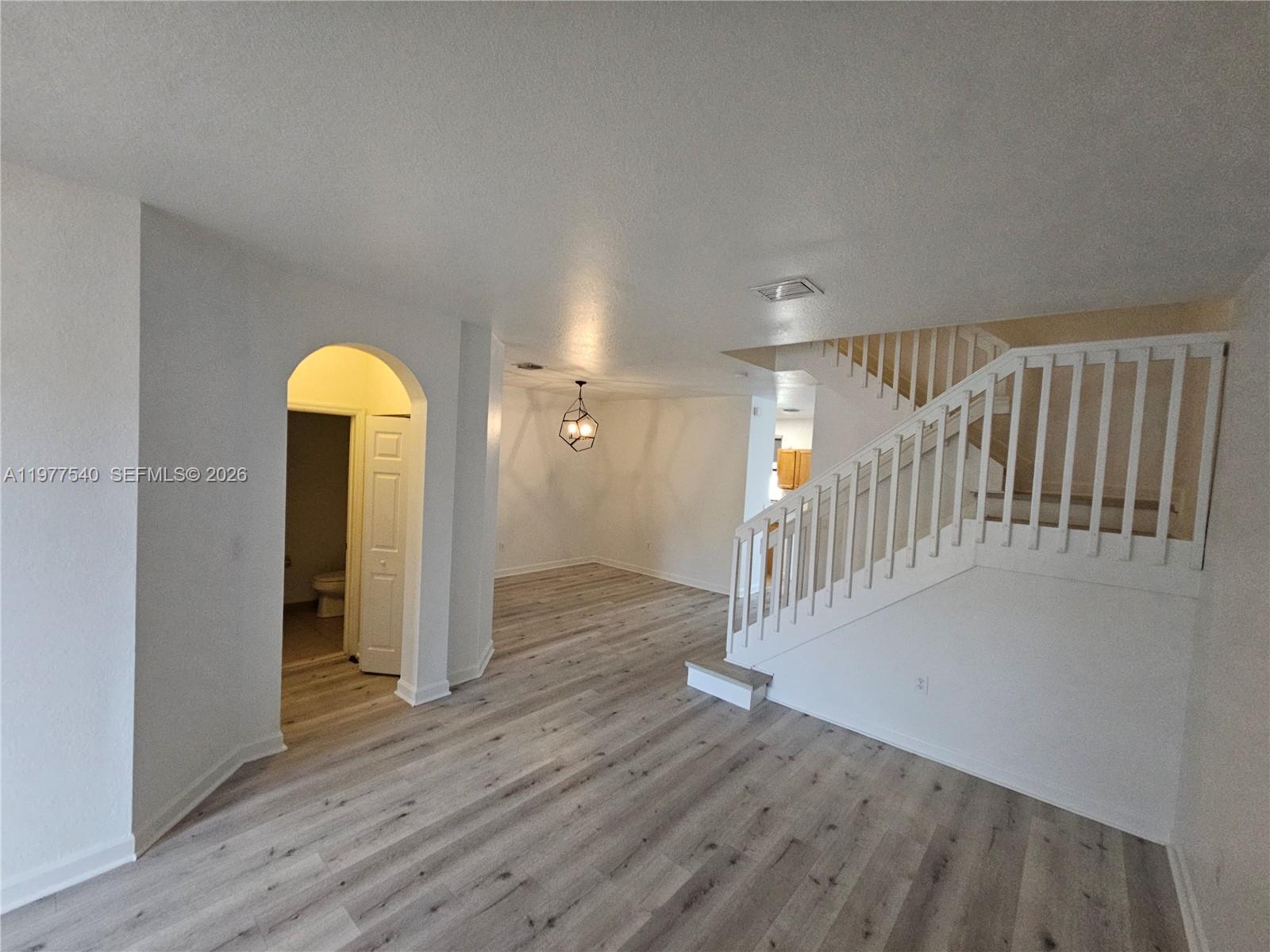 3370 West 90th Street, Unit A Hialeah, FL 33018 - Photo 4 of 40 a view of livingroom with hallway and wooden floor