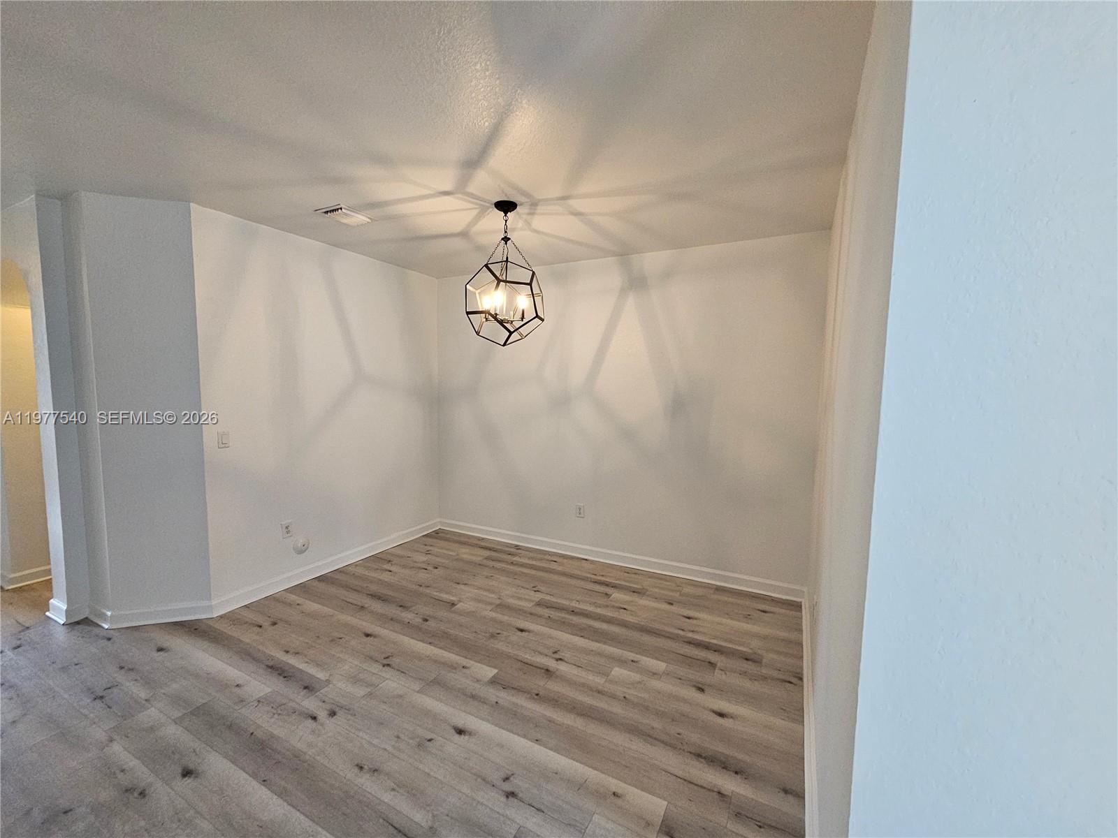 3370 West 90th Street, Unit A Hialeah, FL 33018 - Photo 6 of 40 wooden floor in a empty room