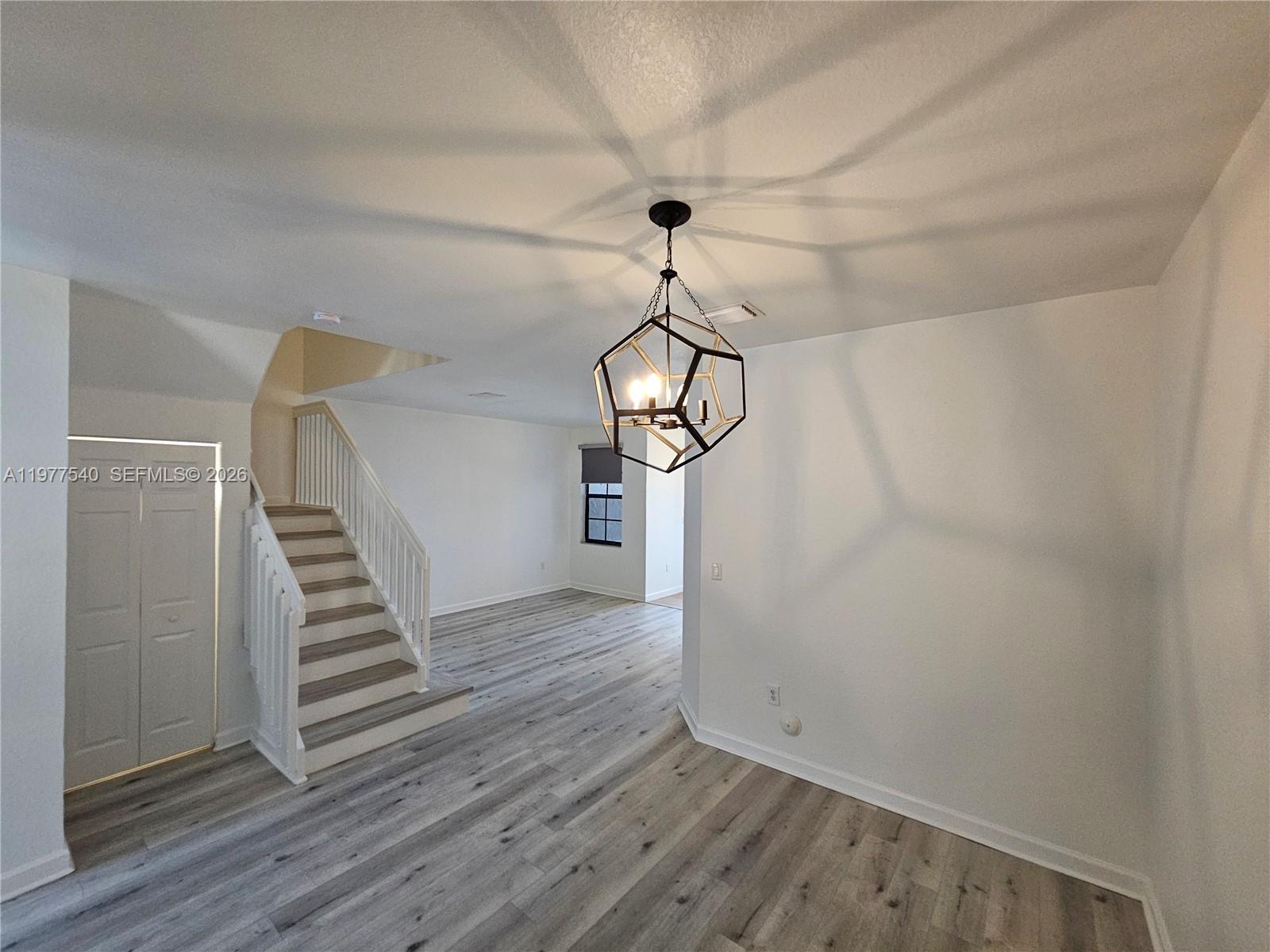 3370 West 90th Street, Unit A Hialeah, FL 33018 - Photo 7 of 40 a view of a hallway with wooden floor and entryway